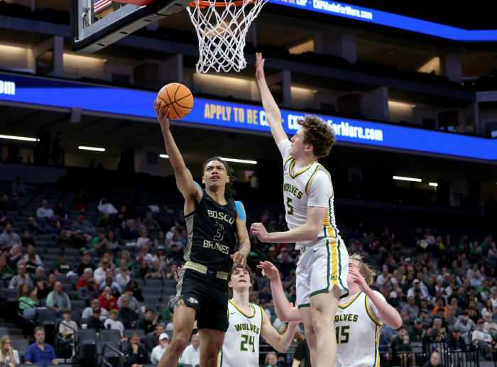Elzie Harrington swoops in for two of his 12 points to go along with seven assists.